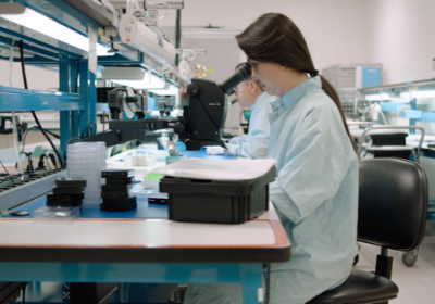 woman using microscope