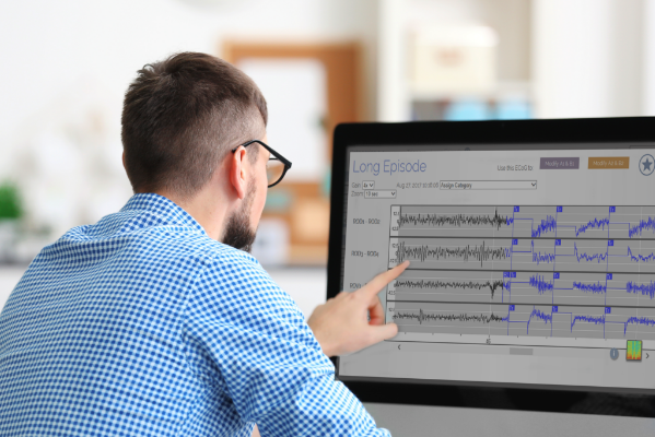 man analyzing computer chart