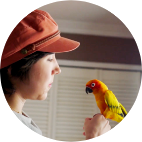 Photograph of Kathleen holding a bird