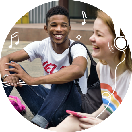 Photo of two young people enjoying music